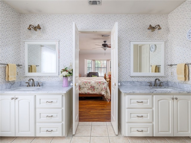 bathroom featuring tile patterned flooring, ceiling fan, and vanity