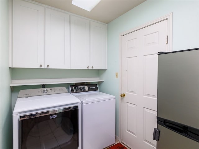 laundry area featuring cabinets and independent washer and dryer