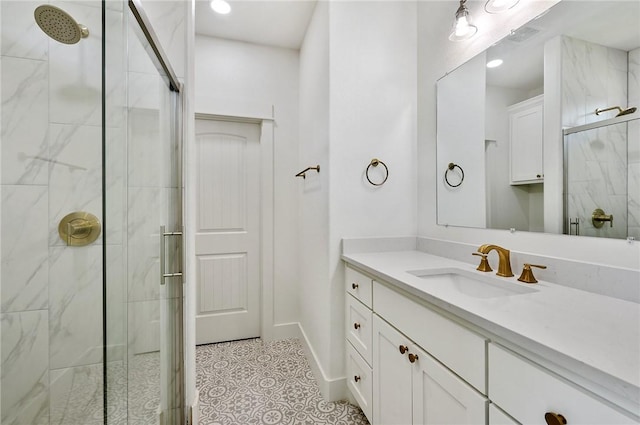 bathroom featuring vanity and a shower with shower door