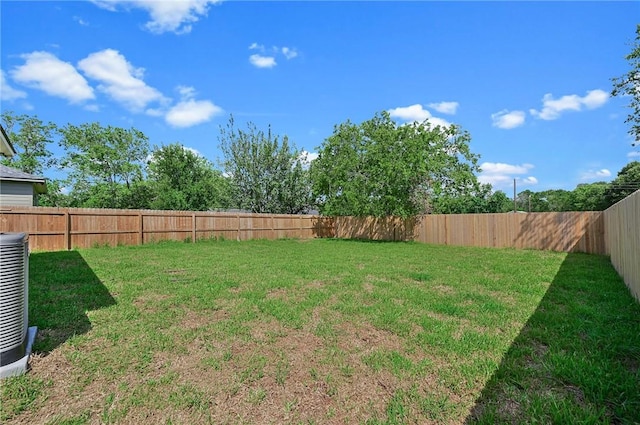 view of yard with central AC unit