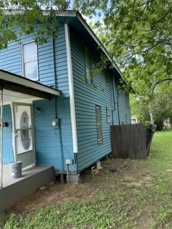 view of side of property with fence