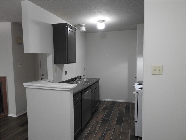 1107 Verde Dr Unit 60, Bryan, TX 77801 - kitchen with dishwasher, a sink, dark wood-style floors, white electric range, and a textured ceiling