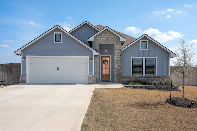 craftsman house with a front yard and a garage