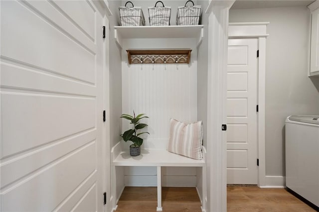 mudroom featuring light hardwood / wood-style flooring and washer / dryer