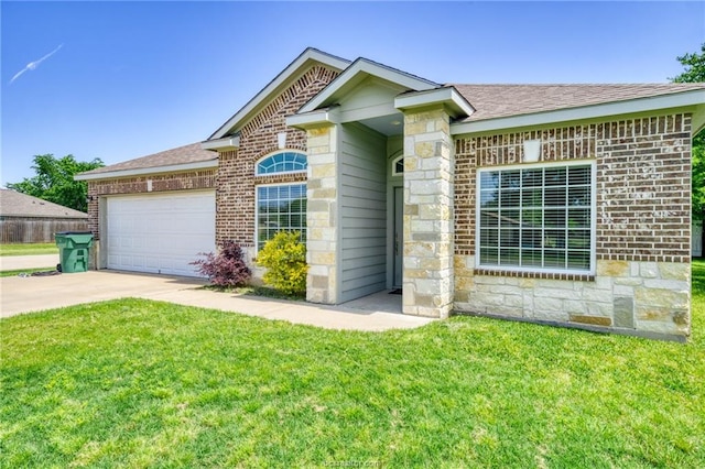 single story home with a front yard, concrete driveway, brick siding, and an attached garage