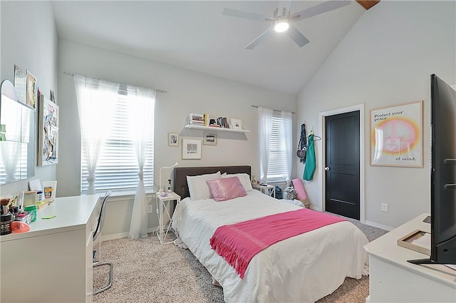 303 Luther St, College Station, TX 77840 - bedroom with light colored carpet, a desk, baseboards, high vaulted ceiling, and ceiling fan
