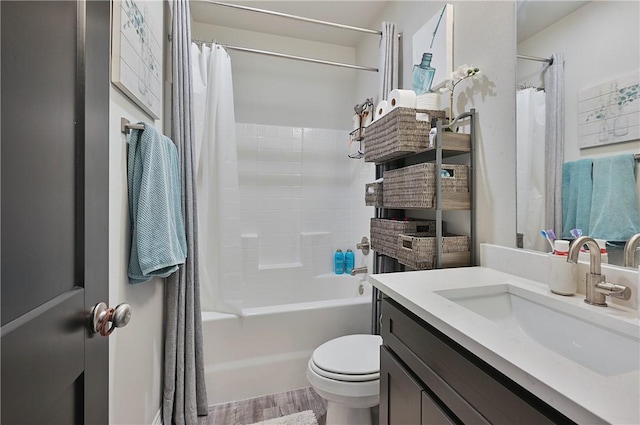 303 Luther St, College Station, TX 77840 - full bath with vanity, toilet, wood finished floors, and shower / tub combo