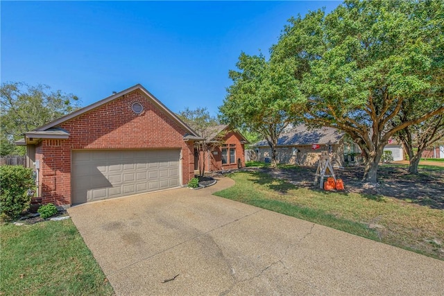 view of front of property featuring a front yard and a garage