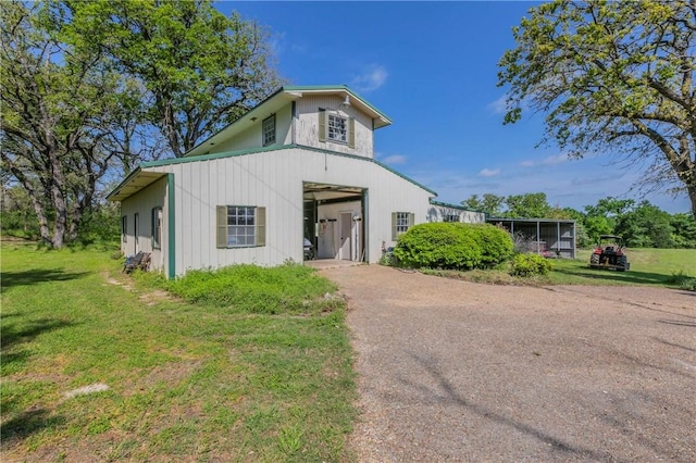 180 Fcr 797, Donie, TX 75838 - view of front of property with asphalt driveway, a front lawn, and an outdoor structure
