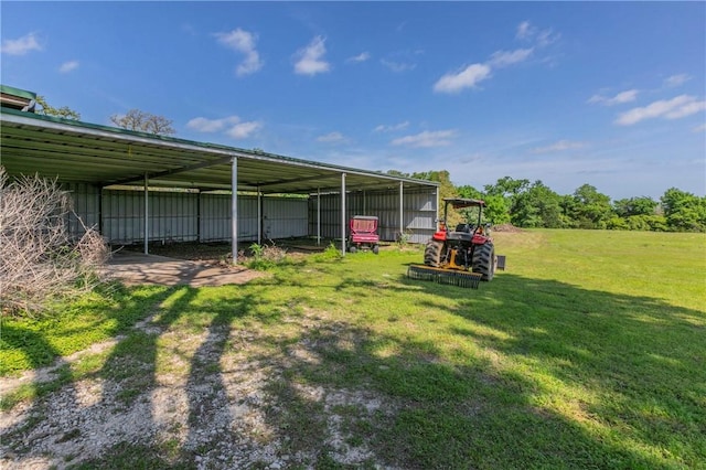 180 Fcr 797, Donie, TX 75838 - view of grassy yard featuring a pole building, a detached carport, and an outbuilding