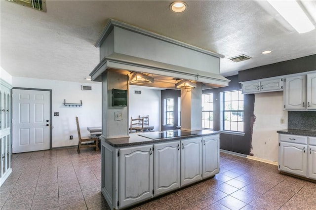 180 Fcr 797, Donie, TX 75838 - kitchen with baseboards, black electric stovetop, dark countertops, recessed lighting, and a textured ceiling