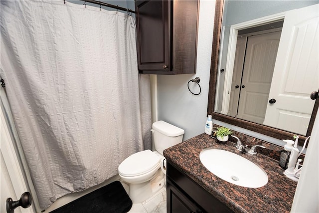 bathroom featuring toilet and vanity