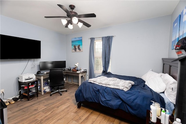 bedroom featuring wood-type flooring and ceiling fan