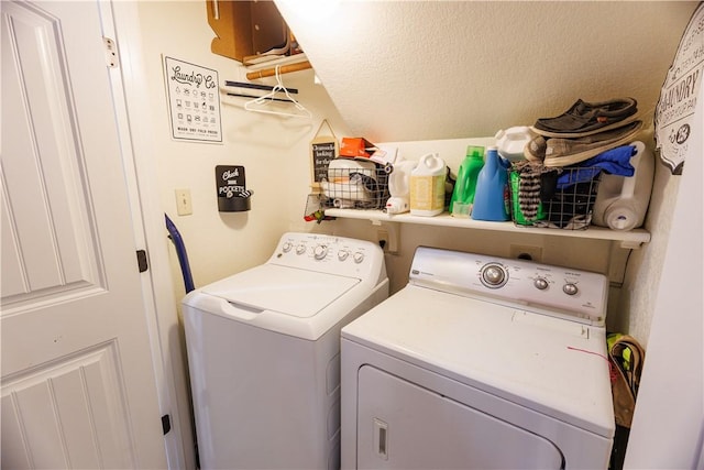 clothes washing area with washing machine and clothes dryer