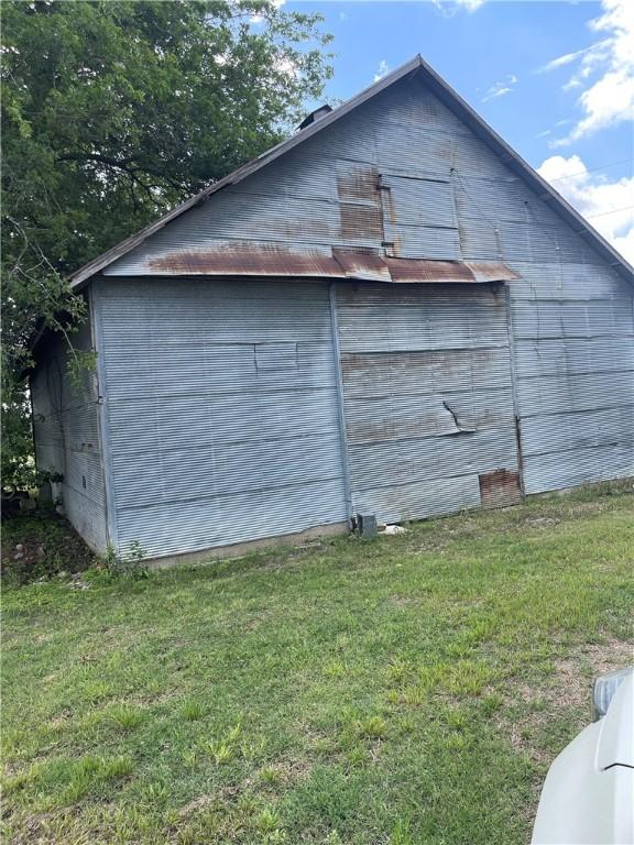 6268 Fm 2269, Cameron, TX 76518 - view of home's exterior featuring a lawn, an outdoor structure, and a barn