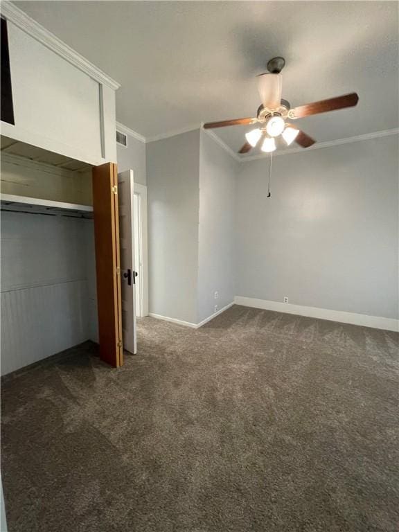 6268 Fm 2269, Cameron, TX 76518 - unfurnished bedroom featuring crown molding, dark colored carpet, baseboards, ceiling fan, and a closet