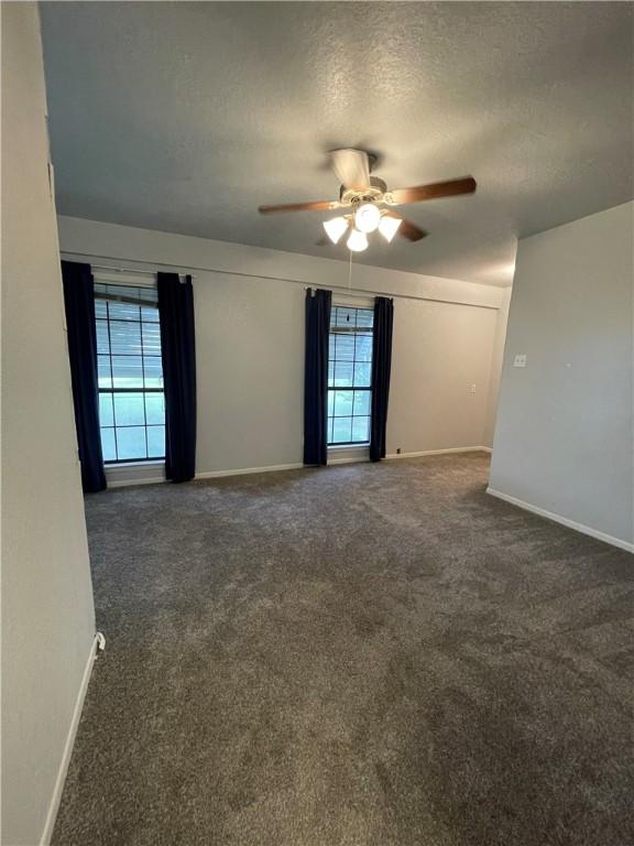 6268 Fm 2269, Cameron, TX 76518 - empty room with a ceiling fan, carpet floors, a textured ceiling, and baseboards