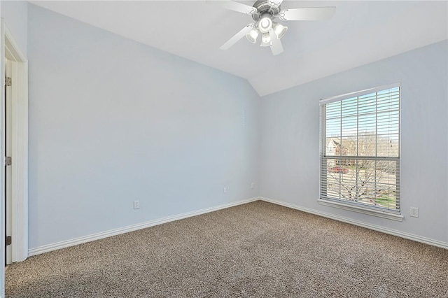 carpeted spare room with lofted ceiling and ceiling fan