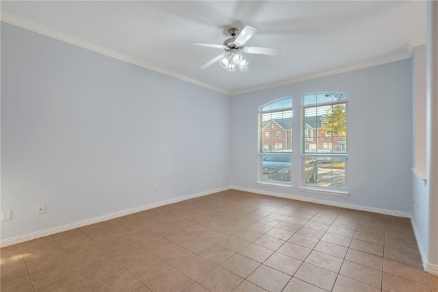 tiled empty room featuring ornamental molding and ceiling fan