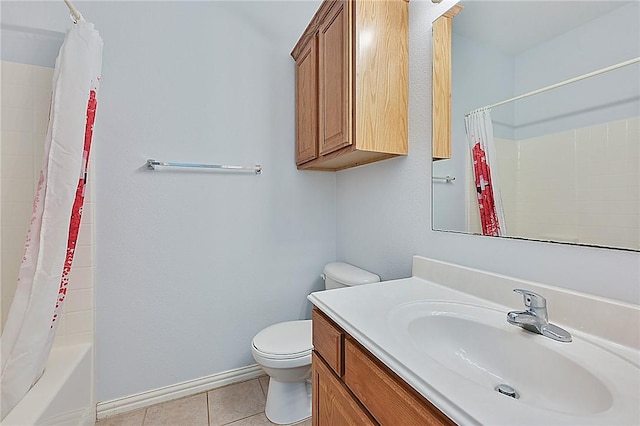 full bathroom with tile patterned floors, shower / tub combo with curtain, vanity, and toilet