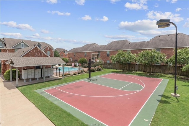 view of basketball court with a yard and a fenced in pool