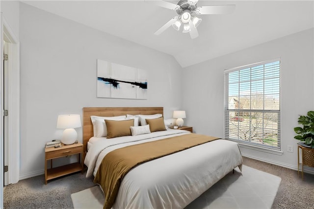 carpeted bedroom with lofted ceiling and ceiling fan