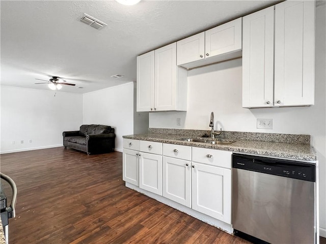 kitchen featuring dishwasher, dark hardwood / wood-style flooring, white cabinets, and sink