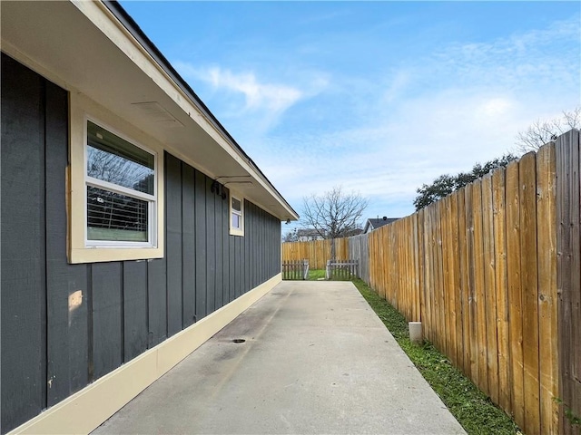 view of side of home with a patio area