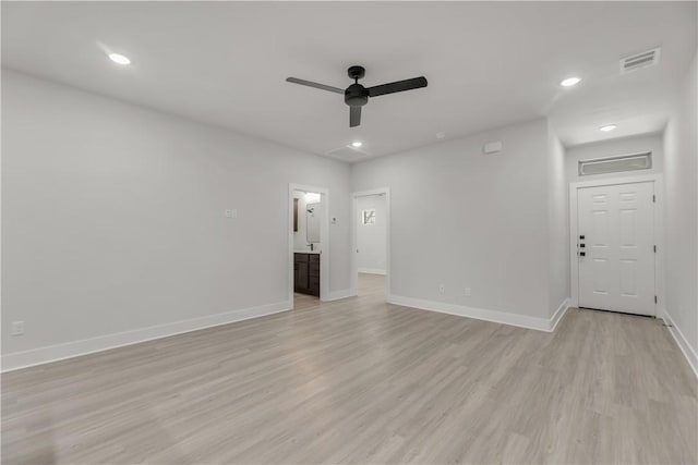 unfurnished room featuring light hardwood / wood-style flooring and ceiling fan