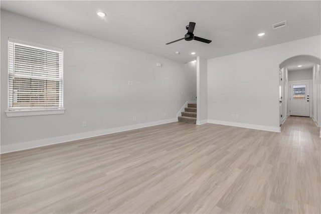 empty room featuring light hardwood / wood-style flooring and ceiling fan