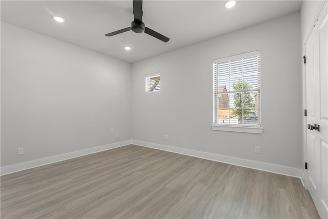 unfurnished room featuring ceiling fan and light wood-type flooring