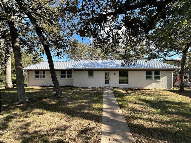 ranch-style house with a front lawn