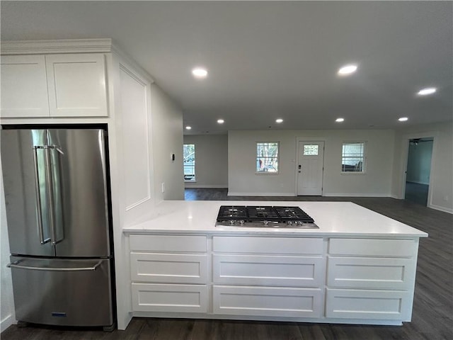 kitchen featuring white cabinetry, dark hardwood / wood-style flooring, and stainless steel appliances