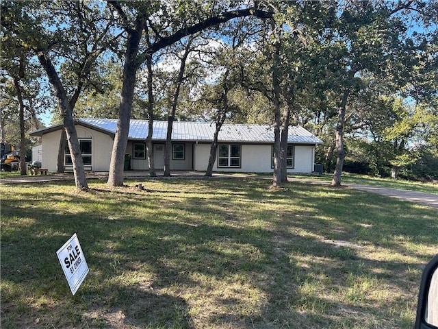 ranch-style house with a front lawn