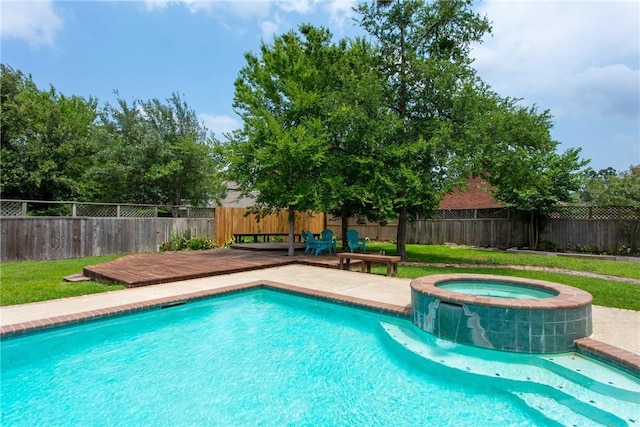 view of pool with an in ground hot tub and a deck