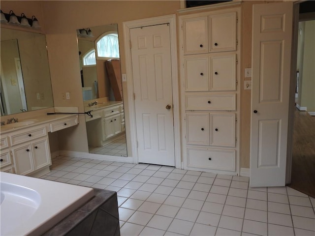 bathroom with tile patterned flooring and vanity