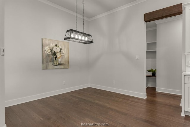 unfurnished dining area with built in shelves, ornamental molding, and dark wood-type flooring