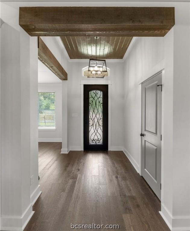 2023 Lola Ln, Bryan, TX 77807 - foyer featuring a chandelier, wood ceiling, dark wood-type flooring, and crown molding