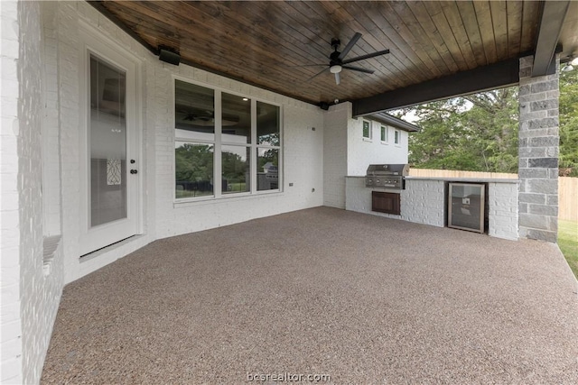 2023 Lola Ln, Bryan, TX 77807 - view of patio with exterior kitchen, ceiling fan, and beverage cooler