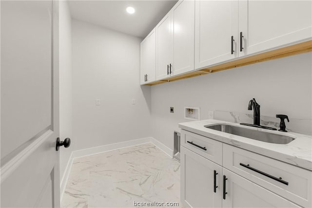 2023 Lola Ln, Bryan, TX 77807 - washroom with electric dryer hookup, cabinet space, hookup for a washing machine, light marble finish floors, and recessed lighting