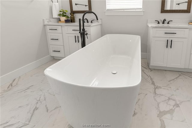 2023 Lola Ln, Bryan, TX 77807 - full bath featuring marble finish flooring, two vanities, and a freestanding bath