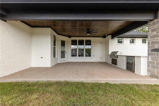 2023 Lola Ln, Bryan, TX 77807 - view of patio / terrace with area for grilling, ceiling fan, and beverage cooler