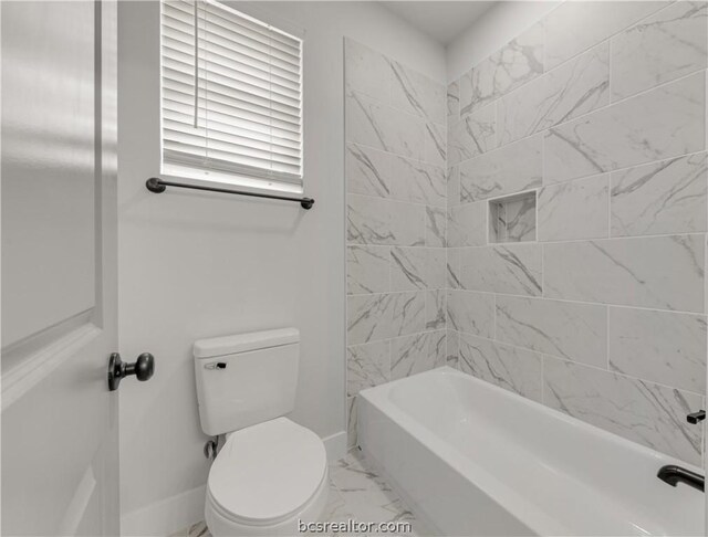 2023 Lola Ln, Bryan, TX 77807 - full bathroom featuring marble look tiles and washtub / shower combination