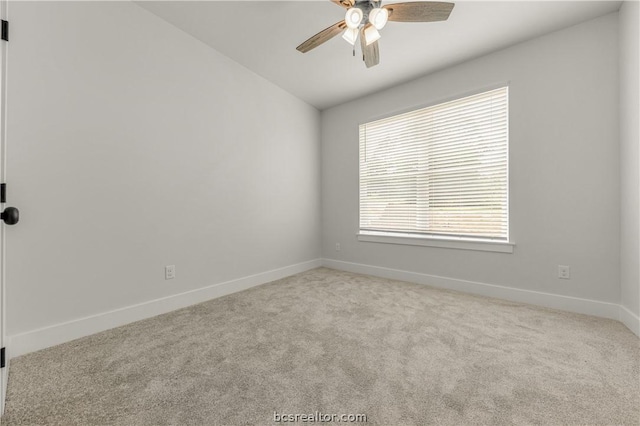 2023 Lola Ln, Bryan, TX 77807 - unfurnished room with a ceiling fan, carpet floors, and vaulted ceiling
