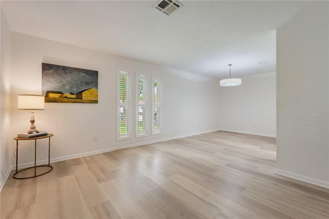 1818 Laura Ln, College Station, TX 77840 - spare room featuring light wood-type flooring and baseboards