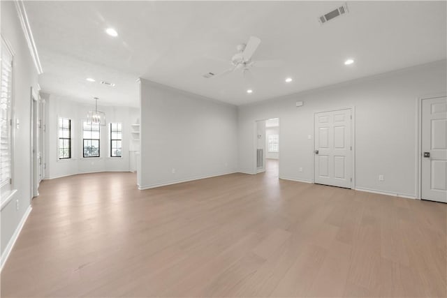 unfurnished living room with visible vents, crown molding, recessed lighting, ceiling fan with notable chandelier, and light wood-style floors