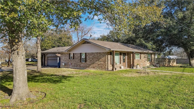 single story home with a garage and a front lawn