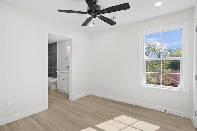 spare room featuring light wood-type flooring