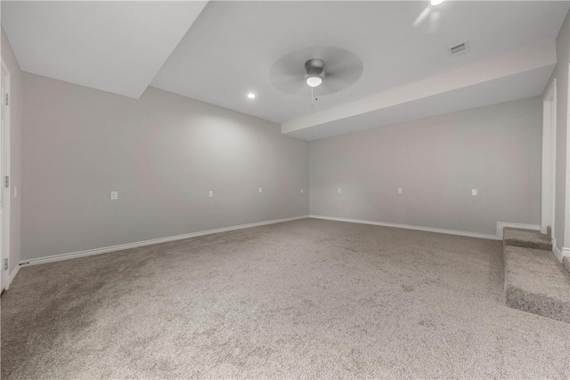 empty room with ceiling fan and carpet flooring