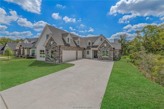 view of front of property featuring a garage and a front lawn